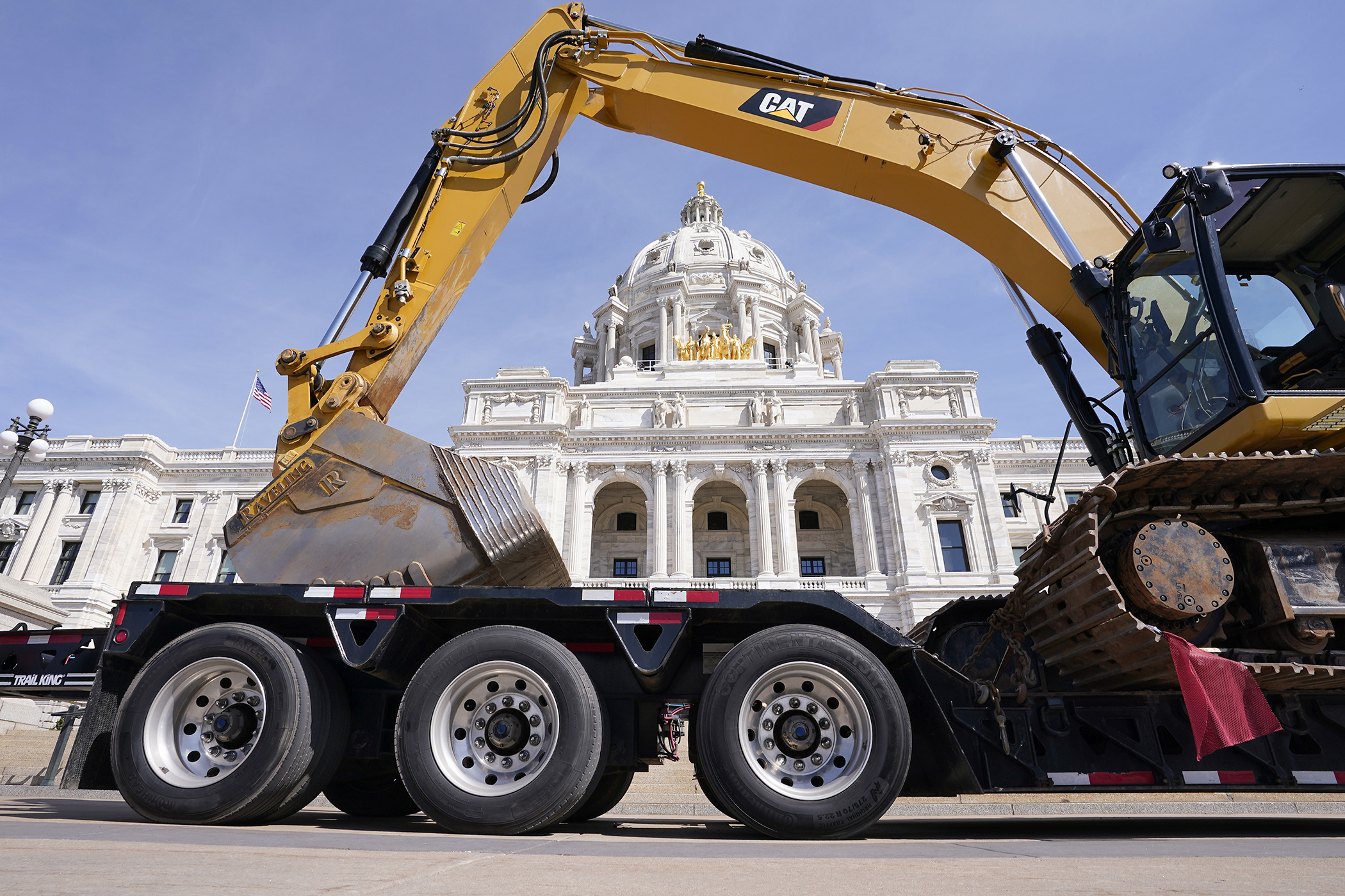 The Capitol dome is framed by the arm of an excavator during a Building Trades Rally for Jobs April 30. (Photo by Michele Jokinen)
